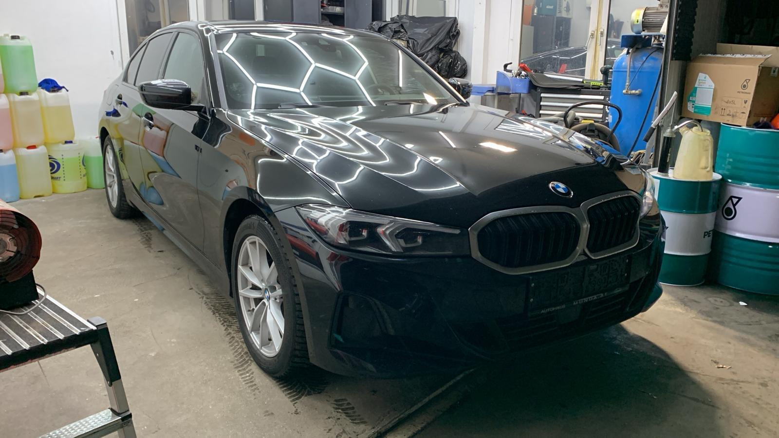 Black BMW in the workshop